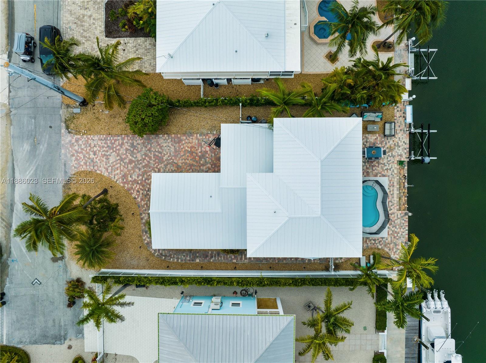511 4th Street Key Colony Beach, FL 33051 - Photo 32 of 41 an aerial view of a house with a yard and a large pool