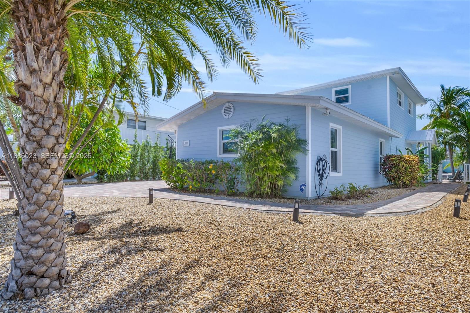 511 4th Street Key Colony Beach, FL 33051 - Photo 36 of 41 a front view of a house with a yard