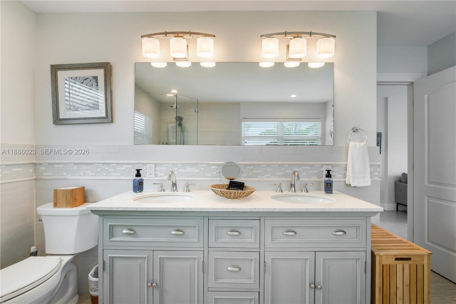 511 4th Street Key Colony Beach, FL 33051 - Photo 7 of 41 a bathroom with a sink and a mirror