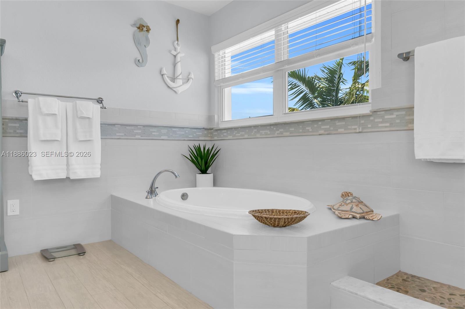 511 4th Street Key Colony Beach, FL 33051 - Photo 8 of 41 a bathroom with a tub sink and mirror
