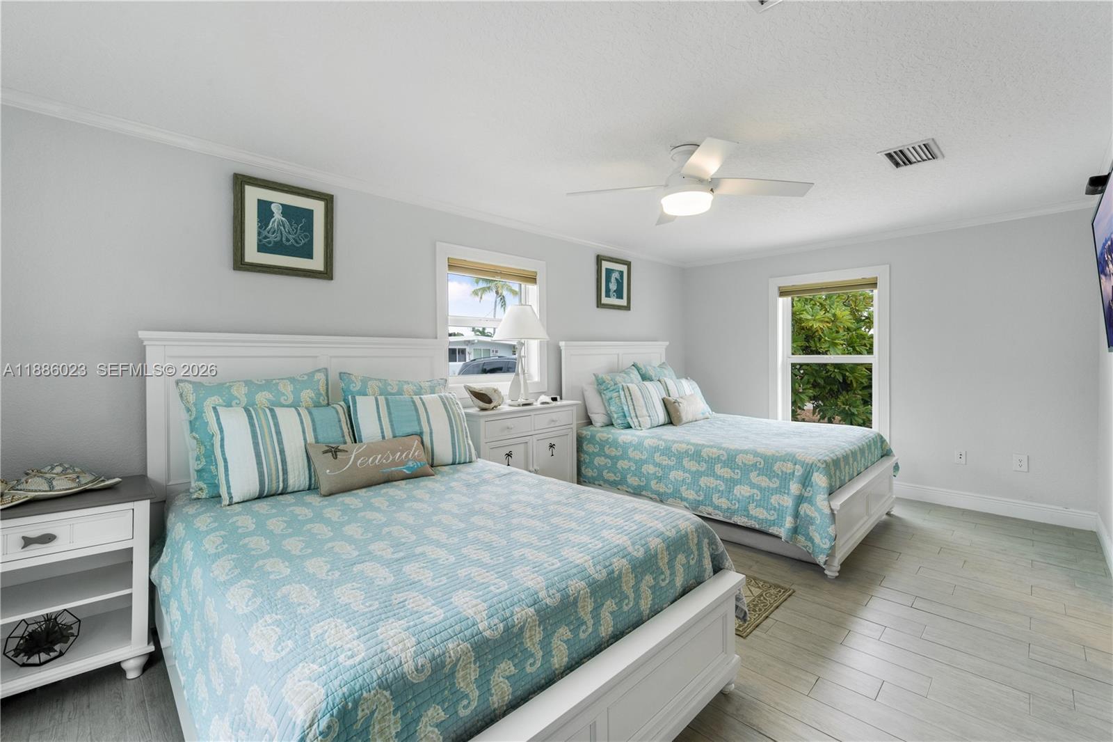 511 4th Street Key Colony Beach, FL 33051 - Photo 10 of 41 a bedroom with two beds and a window