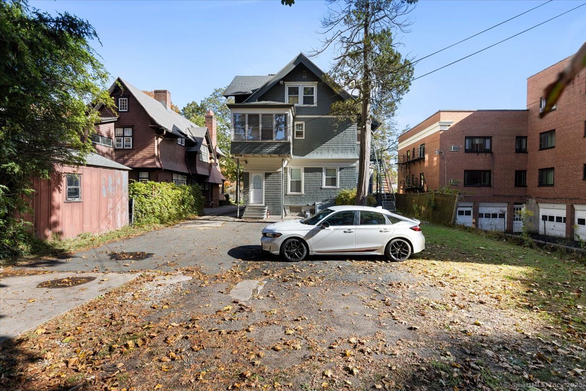 590 Whitney Avenue, Unit 2 New Haven, CT 06511 - Photo 17 of 18 a front view of a house with a yard