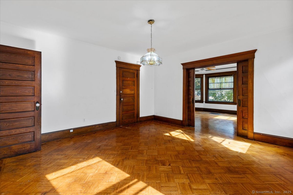 590 Whitney Avenue, Unit 2 New Haven, CT 06511 - Photo 7 of 18 a view of a room with window wooden floor and door