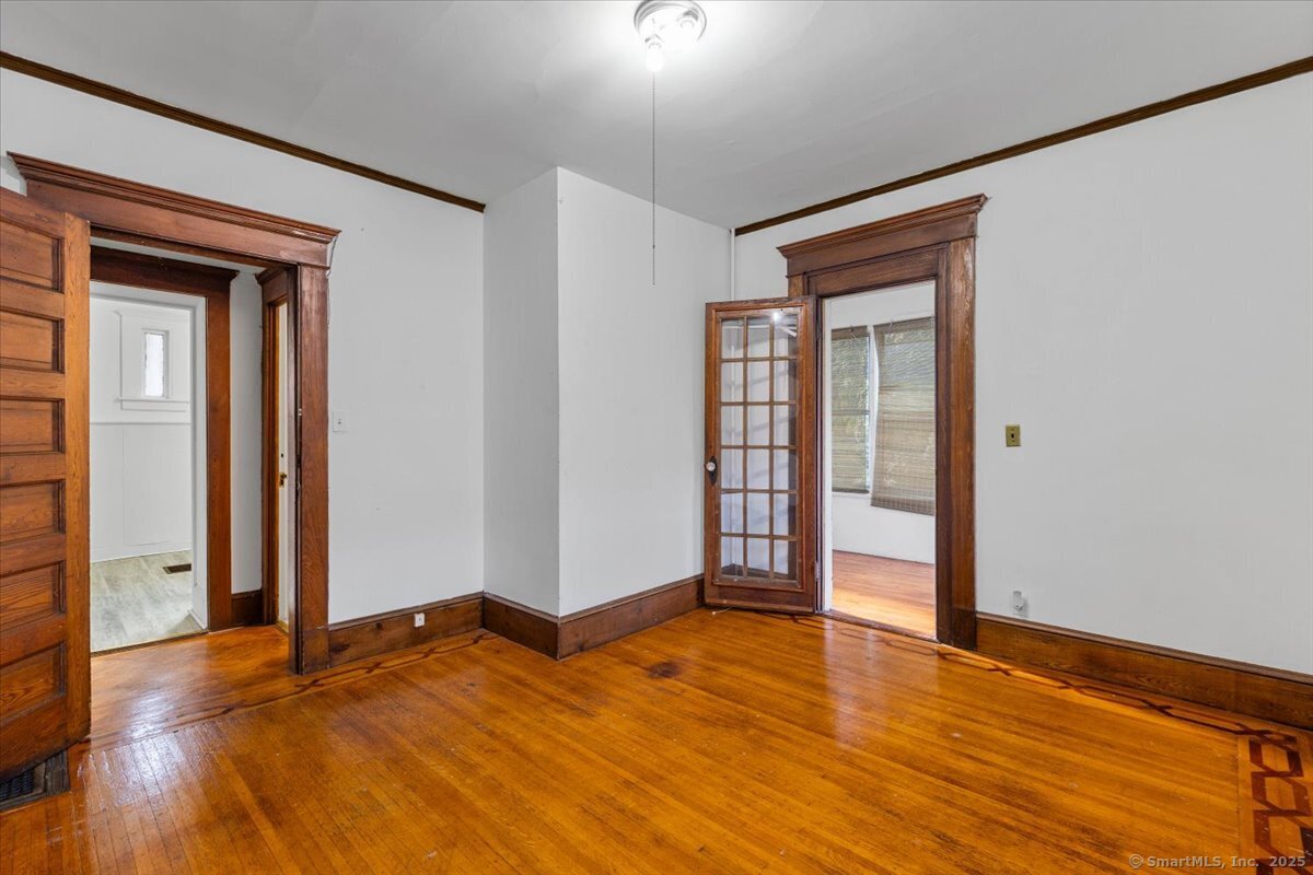 590 Whitney Avenue, Unit 2 New Haven, CT 06511 - Photo 9 of 18 a view of empty room with wooden floor