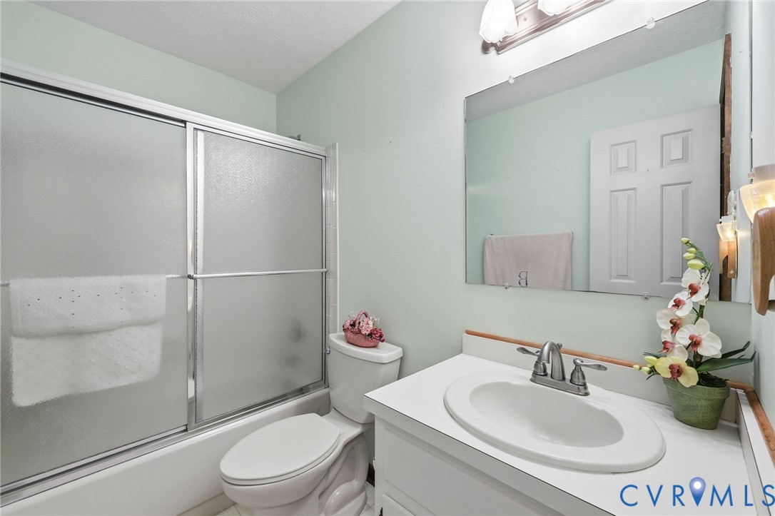 10111 Tunstall Road New Kent, VA 23124 - Photo 24 of 52 Bathroom featuring a white vanity with an integrat