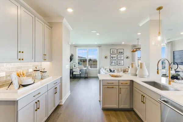 a kitchen with lot of cabinets and sink