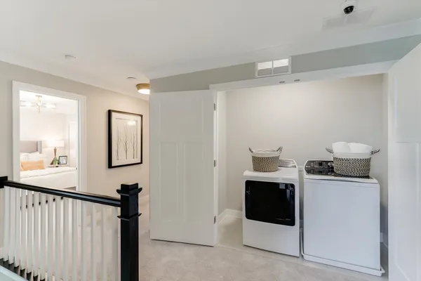 a view of a hallway with workspace and a window