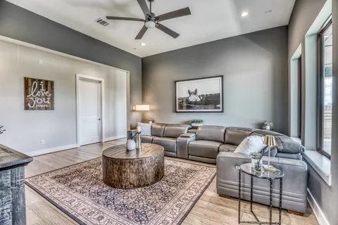 a living room with furniture and a rug