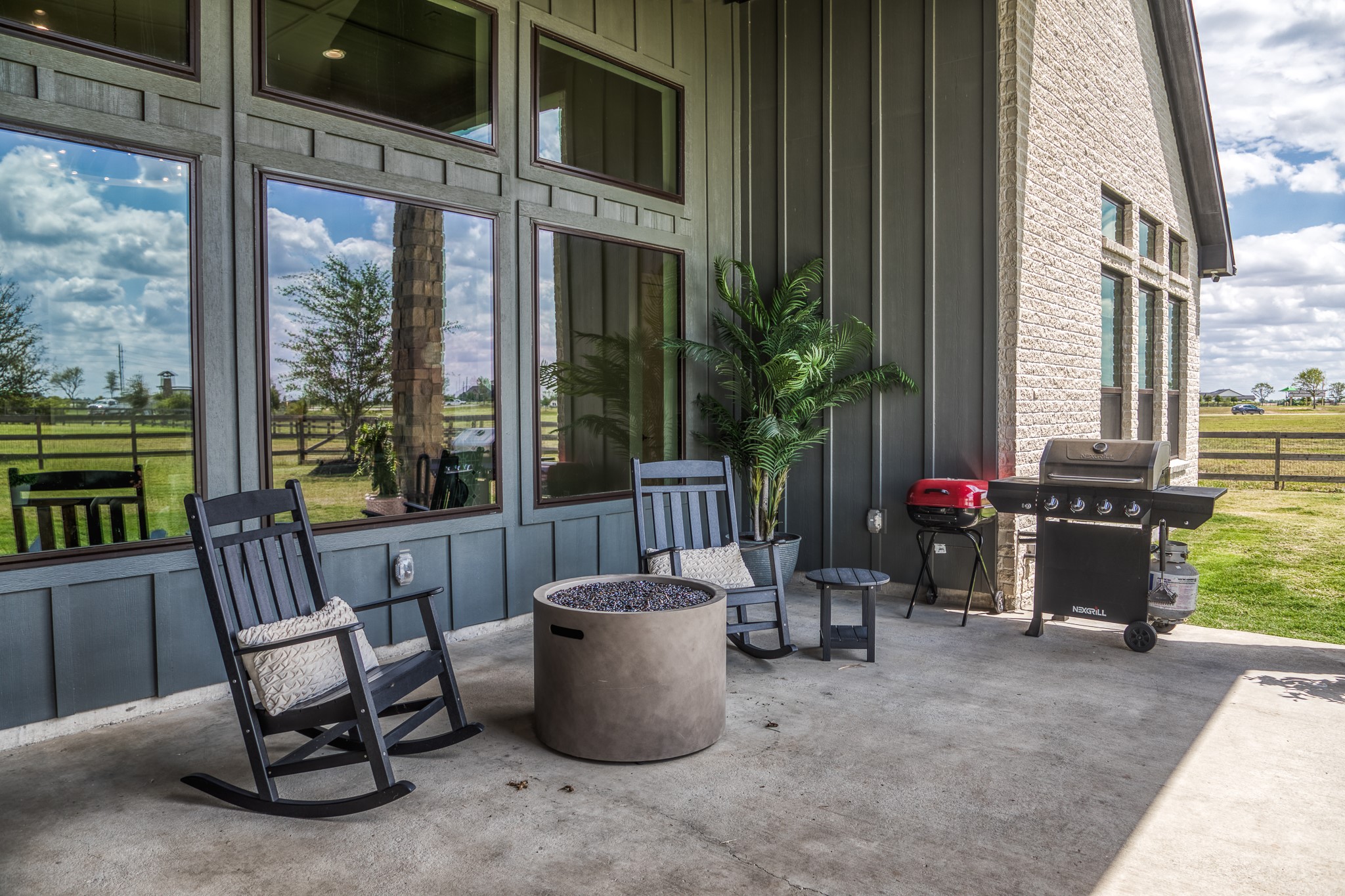 4009 Ranch Home Drive Waller, TX 77484 - Photo 43 of 49 a view of a patio with a dining table and chairs