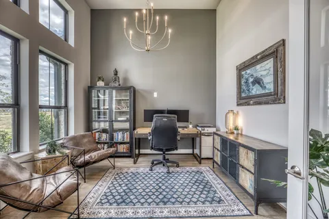 a work room with furniture and a window