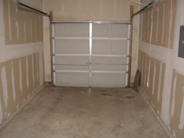 a view of an empty room with a walk in closet