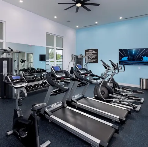 a gym room with lots of gym equipment
