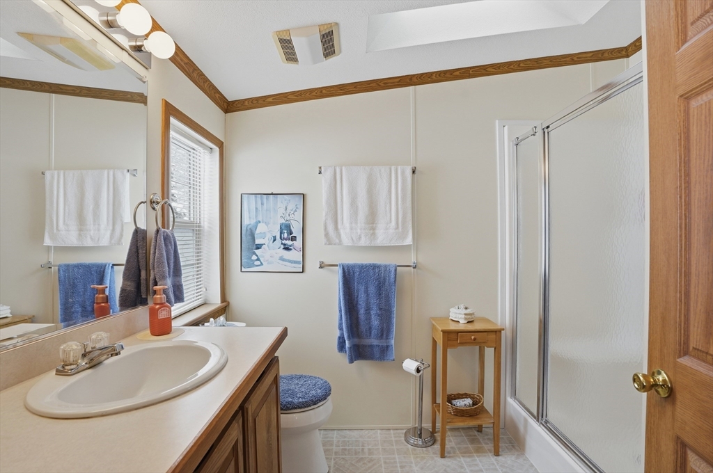 5 Cabot Road Winchendon, MA 01475 - Photo 16 of 31 a bathroom with a sink toilet and mirror