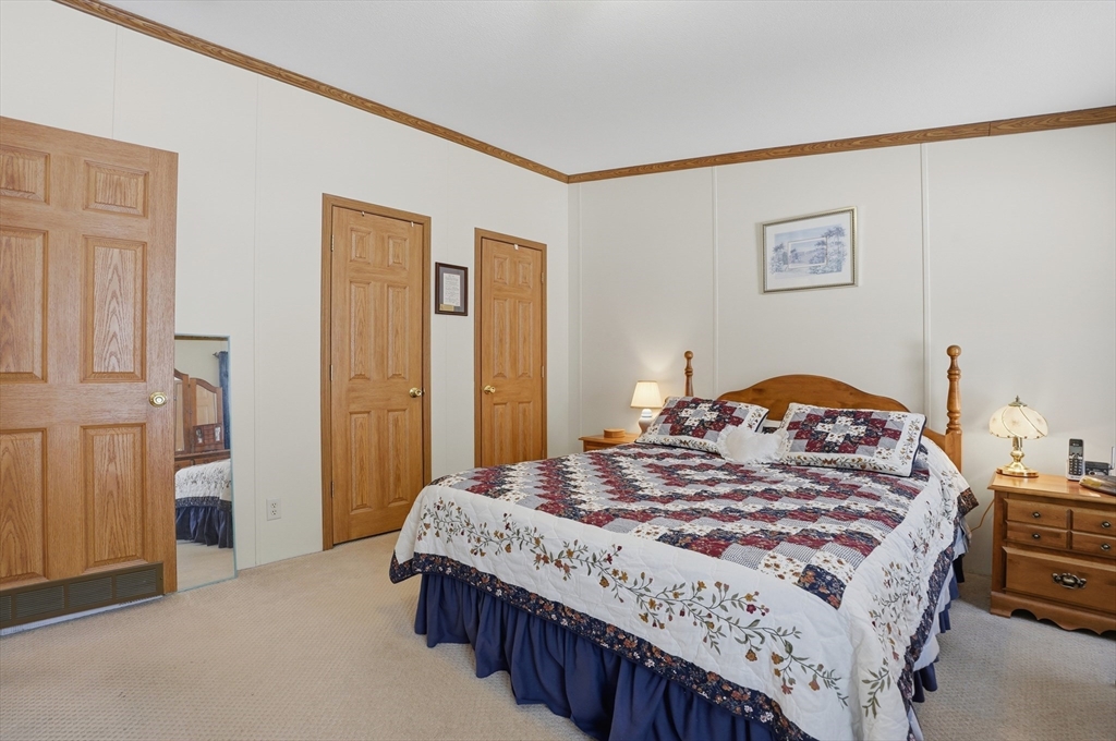 5 Cabot Road Winchendon, MA 01475 - Photo 18 of 31 a bedroom with a bed and a table in it