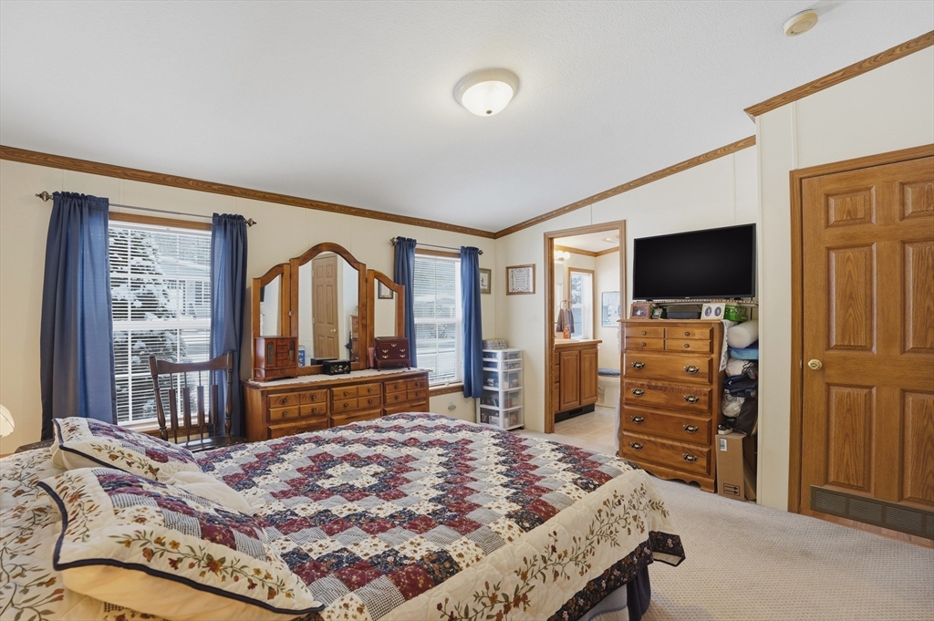 5 Cabot Road Winchendon, MA 01475 - Photo 19 of 31 a bedroom with a bed and a flat screen tv