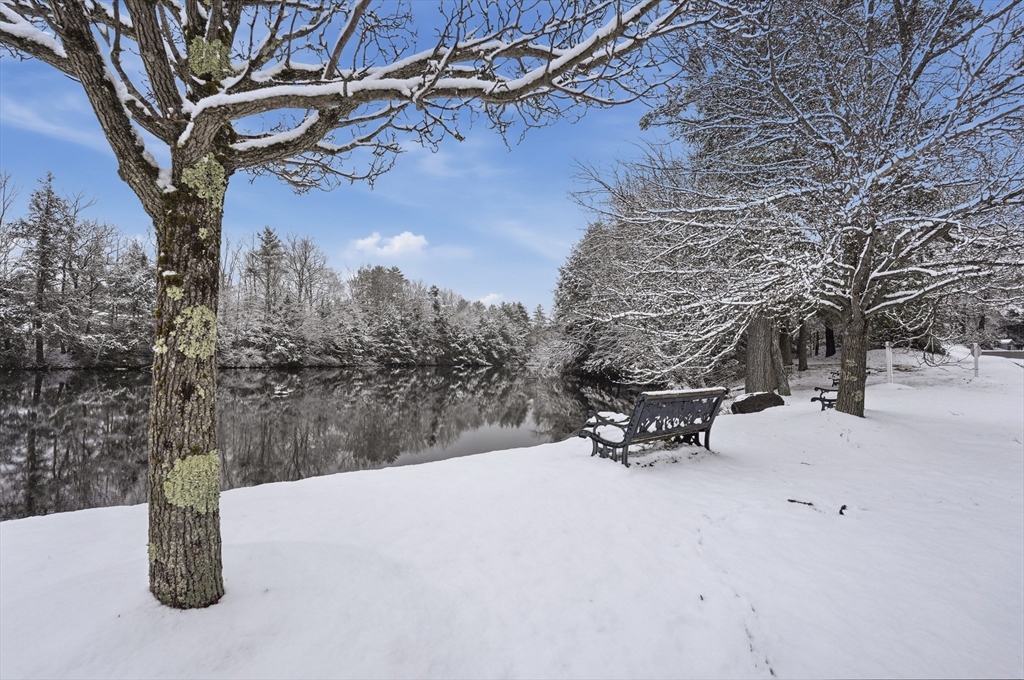 5 Cabot Road Winchendon, MA 01475 - Photo 30 of 31 a bench is sitting in the snow with large trees