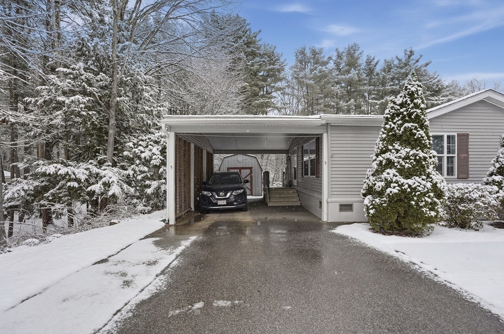 5 Cabot Road Winchendon, MA 01475 - Photo 3 of 31 a view of a car garage and a yard
