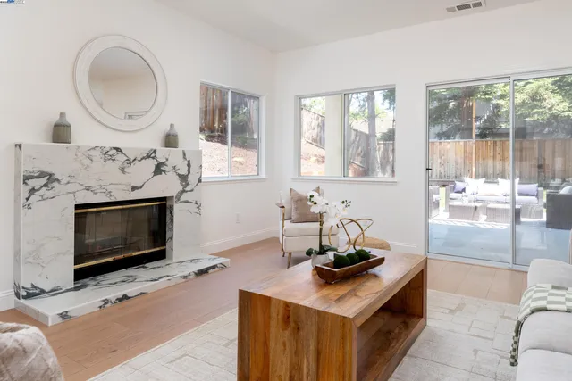 a bedroom with a bed and a night stand