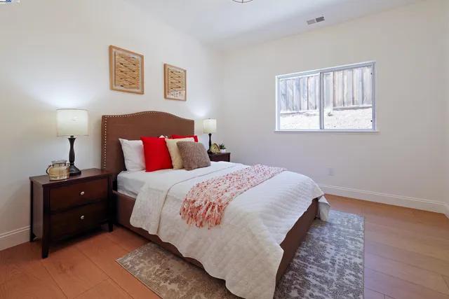 a living room with furniture and a chair