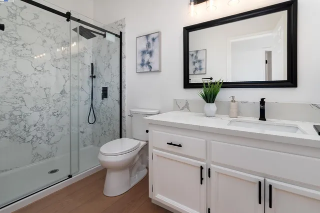 a bed room with a bed and a large window