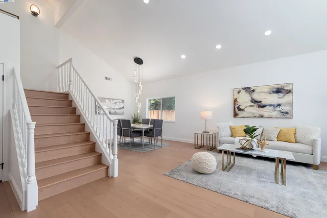 a bedroom with a bed and large window