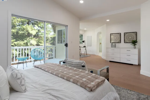 a bathroom with a glass shower door a sink and a mirror