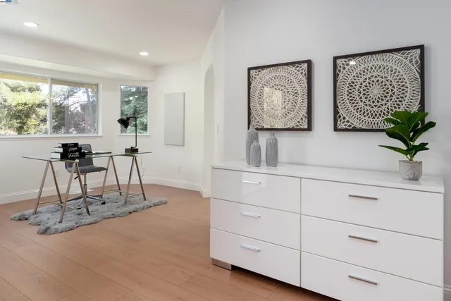 a spacious bathroom with double vanity and a mirror
