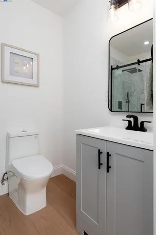 a bedroom with a bed and windows