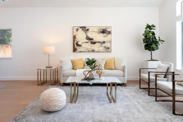 a living room with furniture and a lamp