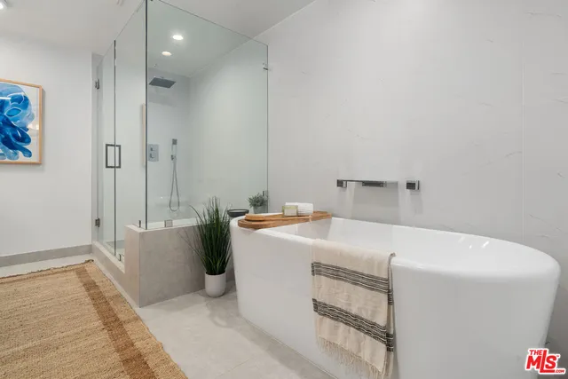 a white bath tub sitting in a bathroom