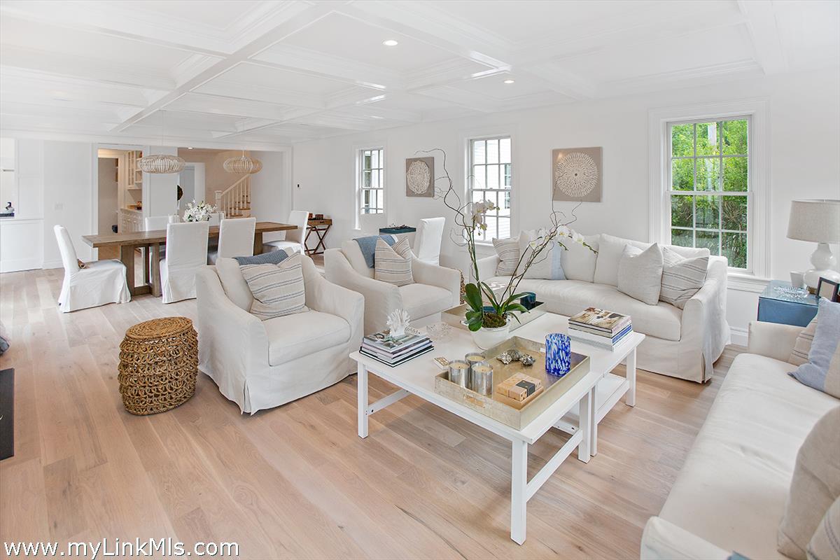 4 Cottle Lane Edgartown, MA 02539 - Photo 11 of 44 a living room with furniture a table and a large window