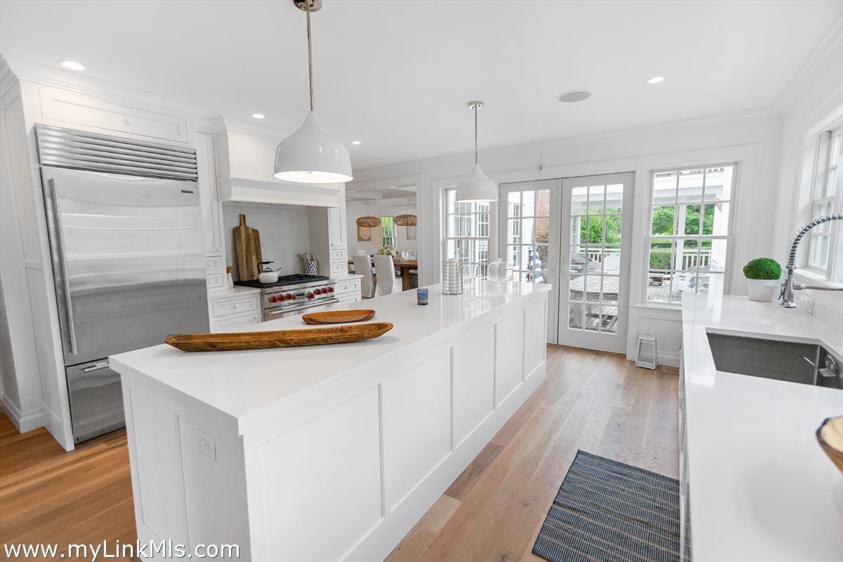 4 Cottle Lane Edgartown, MA 02539 - Photo 15 of 44 a kitchen with sink refrigerator and large window