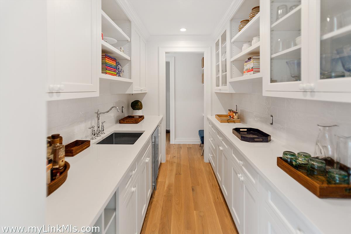 4 Cottle Lane Edgartown, MA 02539 - Photo 17 of 44 a kitchen with stainless steel appliances a stove a sink and a refrigerator