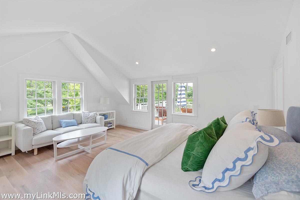4 Cottle Lane Edgartown, MA 02539 - Photo 26 of 44 a living room with furniture and a large window