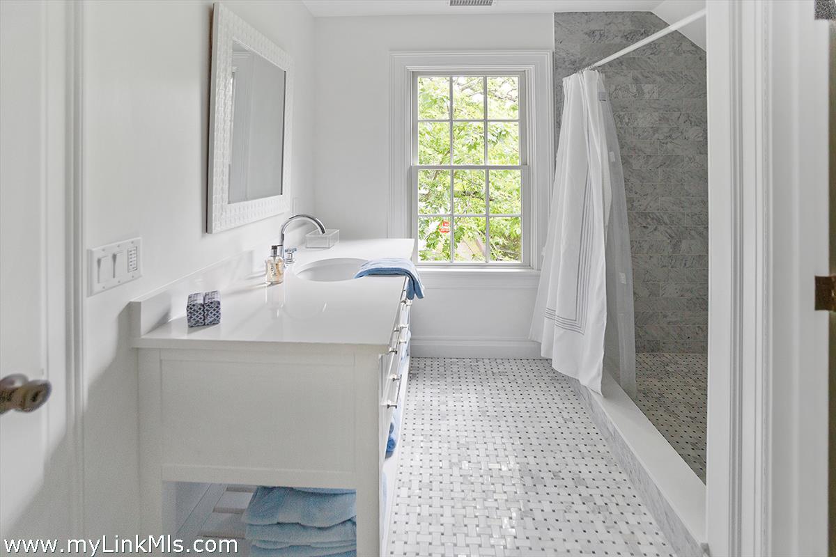 4 Cottle Lane Edgartown, MA 02539 - Photo 33 of 44 a bathroom with a sink a toilet and a shower