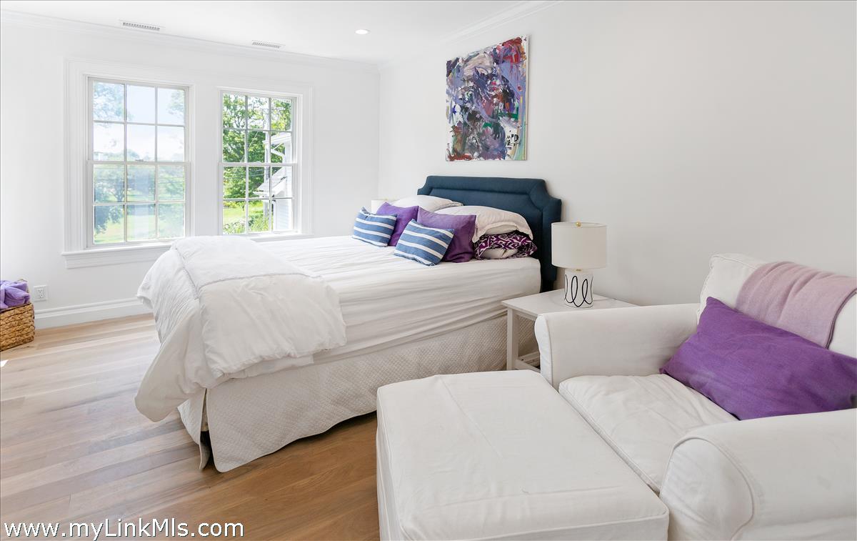 4 Cottle Lane Edgartown, MA 02539 - Photo 35 of 44 a bedroom with a bed and a couch