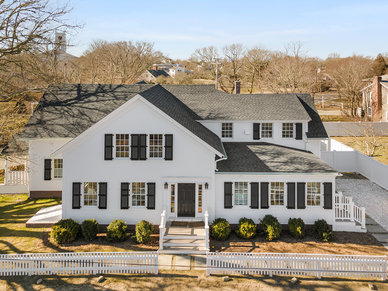 4 Cottle Lane Edgartown, MA 02539 - Photo 5 of 44 a front view of a house with a garden