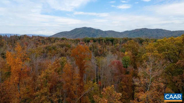 a view of a town with mountains in the background