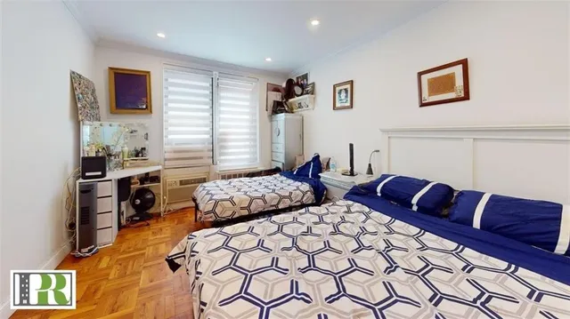 a bedroom with furniture and a bed