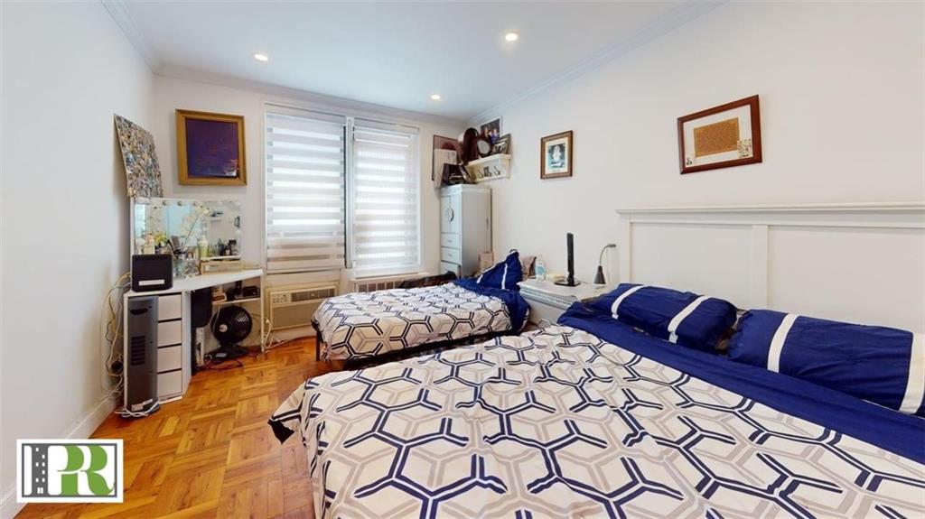 1577 East 17th Street, Unit 2M Brooklyn, NY 11230 - Photo 8 of 10 a bedroom with furniture and a bed