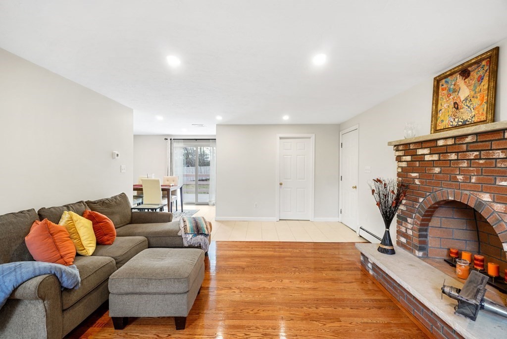 60 Hitching Post Drive Walpole, MA 02081 - Photo 14 of 37 a living room with furniture and a fireplace