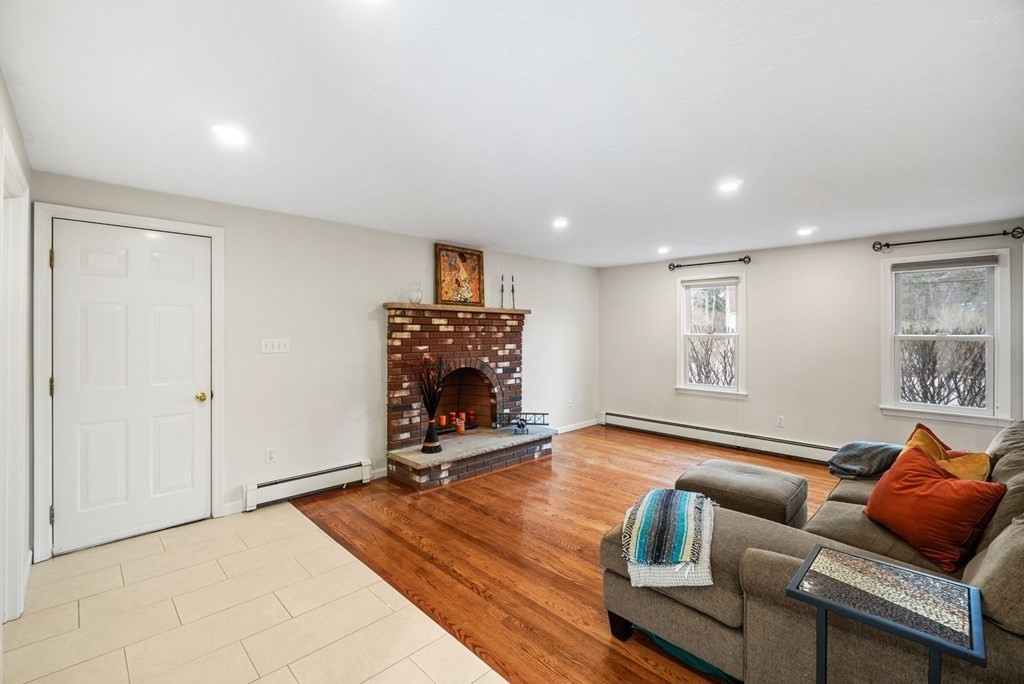 60 Hitching Post Drive Walpole, MA 02081 - Photo 16 of 37 a living room with furniture and a fireplace