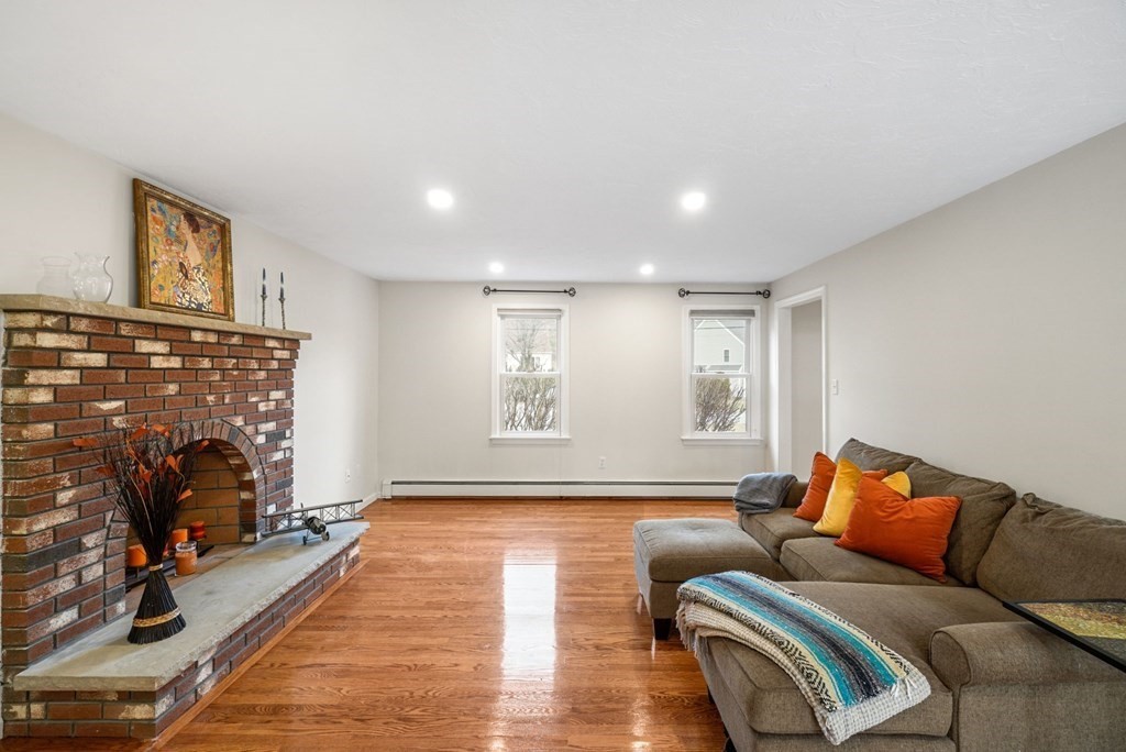 60 Hitching Post Drive Walpole, MA 02081 - Photo 17 of 37 a living room with furniture and a fireplace