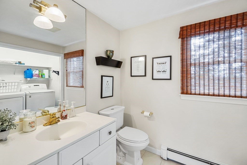 60 Hitching Post Drive Walpole, MA 02081 - Photo 19 of 37 a bathroom with a sink toilet and mirror