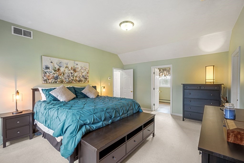 60 Hitching Post Drive Walpole, MA 02081 - Photo 21 of 37 a bedroom with a bed and dresser with mirror