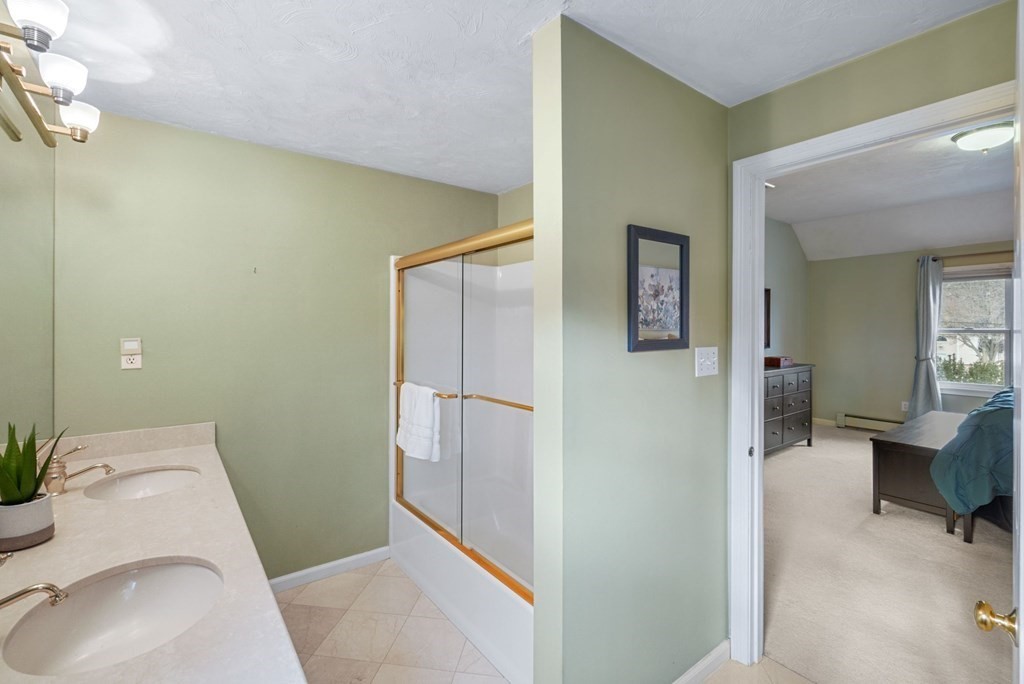 60 Hitching Post Drive Walpole, MA 02081 - Photo 22 of 37 a bathroom with a sink and toilet