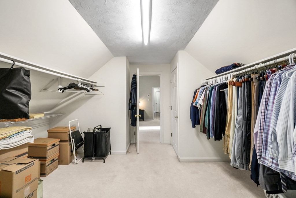 60 Hitching Post Drive Walpole, MA 02081 - Photo 24 of 37 a view of walk in closet with clothes and shoes