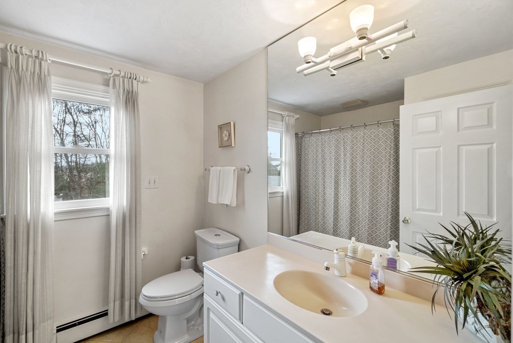 60 Hitching Post Drive Walpole, MA 02081 - Photo 27 of 37 a bathroom with a sink toilet and shower