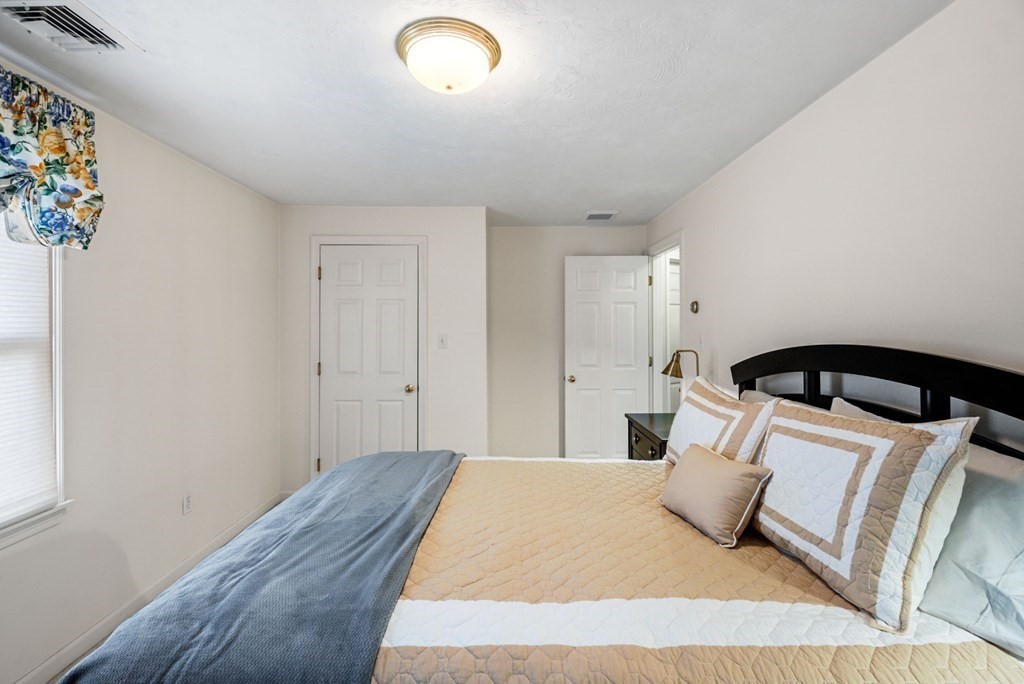 60 Hitching Post Drive Walpole, MA 02081 - Photo 28 of 37 a bedroom with a bed and a window