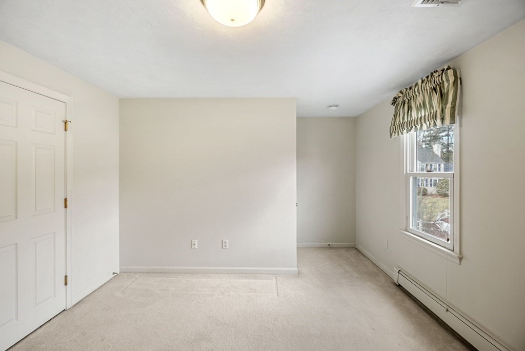 60 Hitching Post Drive Walpole, MA 02081 - Photo 30 of 37 a view of an empty room with a window